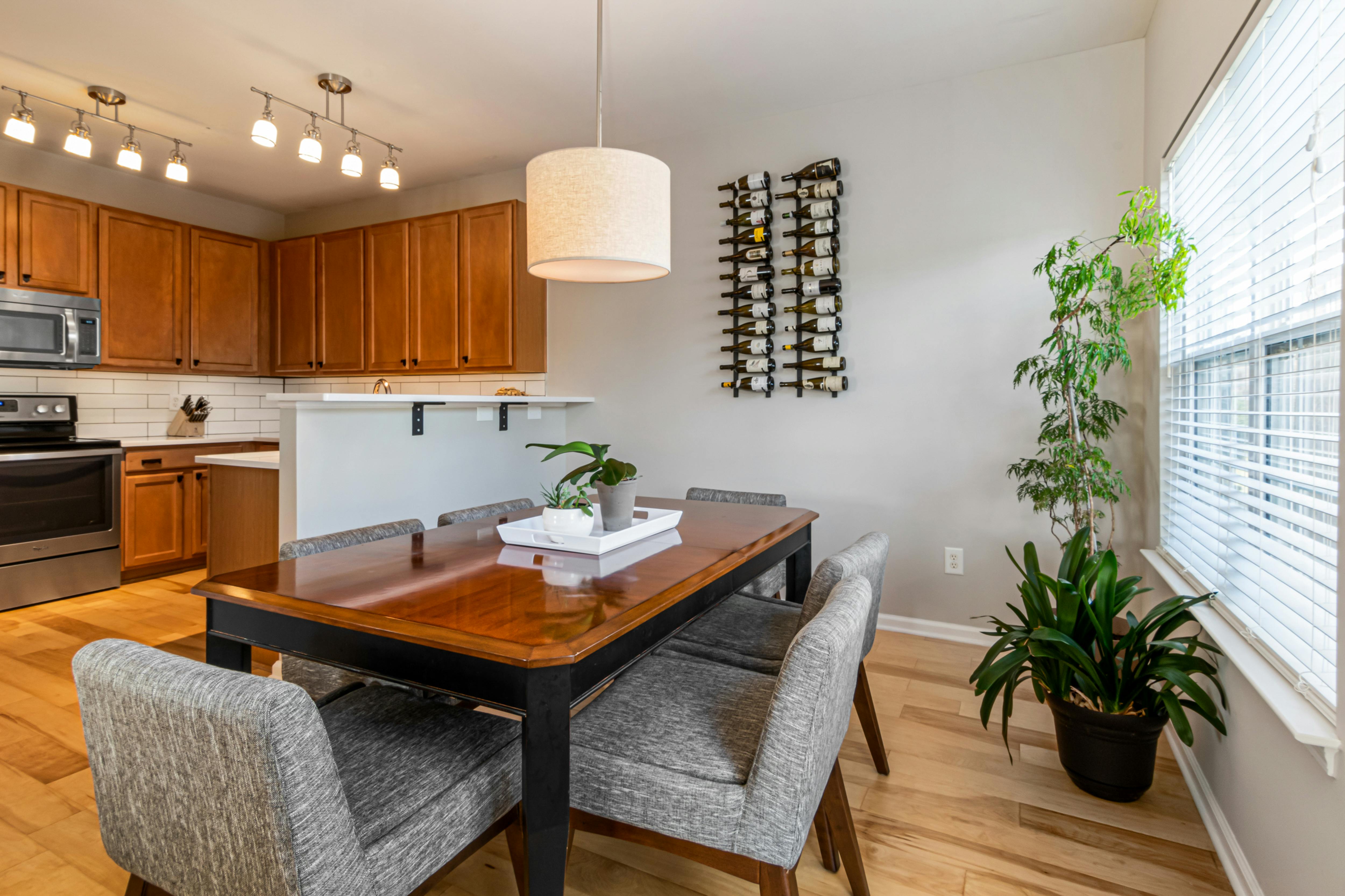 inside kitchen and dining room with wooden accents